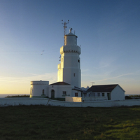 Buy canvas prints of Dawn at the Lighthouse. by Annabelle Ward