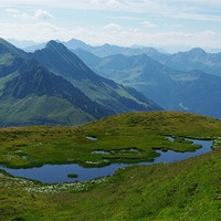Buy canvas prints of Mountain pond with a view near Furkajoch, Austria by Claudio Del Luongo