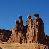 Buy canvas prints of The Three Gossips, Arches National Park by Claudio Del Luongo