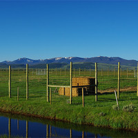 Buy canvas prints of Blue Stream and ranchland near Walden, Colorado by Claudio Del Luongo