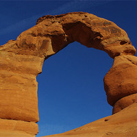 Buy canvas prints of Powerful and gigantic Delicate Arch, Arches Nation by Claudio Del Luongo