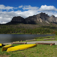 Buy canvas prints of Yellow canoes and Brooks Lake, Wyoming by Claudio Del Luongo