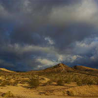 Buy canvas prints of Nevada desert under mixed skies by Claudio Del Luongo