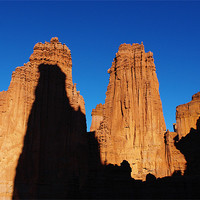 Buy canvas prints of Fisher Towers with climbers by Claudio Del Luongo