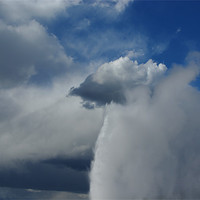 Buy canvas prints of Old Faithful merging with clouds, Yellowstone by Claudio Del Luongo
