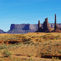 Buy canvas prints of Horses, sand and rock towers, Monument Valley by Claudio Del Luongo
