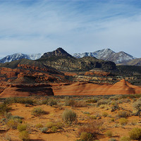 Buy canvas prints of Orange sand, red rocks and Henry Mountains, Utah by Claudio Del Luongo