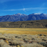 Buy canvas prints of High desert and snowy mountains by Claudio Del Luongo