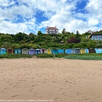 Buy canvas prints of Coldingham Bay with it's colourful beach huts by yvonne & paul carroll