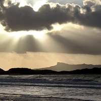 Buy canvas prints of  Sun getting ready to set over Isle of Eigg by yvonne & paul carroll