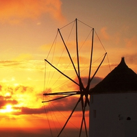 Buy canvas prints of  Oia windmill at sunset by yvonne & paul carroll