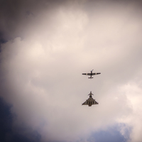 Buy canvas prints of  Eurofighter and Spitfire and the VJ Fly Past at S by Phil Robinson