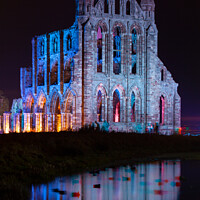 Buy canvas prints of Whitby Abbey Illuminated as for Halloween and Whitby Goth Weeken by Martin Williams