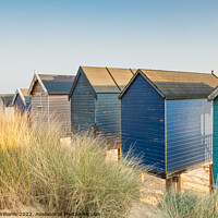 Buy canvas prints of Beach huts at Wells-Next-the-Sea by Martin Williams