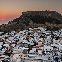 Buy canvas prints of Sunrise over Lindos town, Rhodes, Greece by Martin Williams