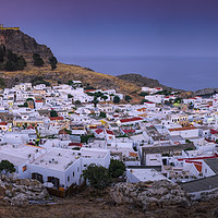 Buy canvas prints of Sunset over Lindos town, Rhodes, Greece, Panoramic by Martin Williams