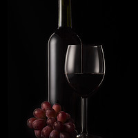 Buy canvas prints of Wine bottle, glass and grapes by Martin Williams