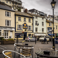 Buy canvas prints of Harbour Cafe, Brixham, England, UK by Mark Llewellyn
