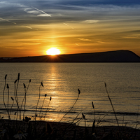 Buy canvas prints of Sunset at Newport Beach, Pembrokeshire, Wales, UK by Mark Llewellyn