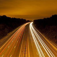 Buy canvas prints of Motorway Light Trails by Simon West