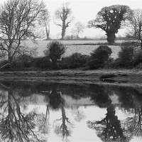 Buy canvas prints of Carew Lake Mill Pond Reflections by Simon West