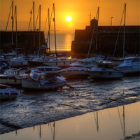 Buy canvas prints of Saundersfoot Harbour at Sunrise by Simon West