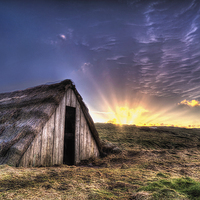 Buy canvas prints of Seaweed drying hut sunrise by Simon West