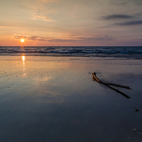 Buy canvas prints of  Saundersfoot Sunrise with Driftwood by Simon West
