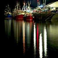 Buy canvas prints of Fishing vessels moored to Portree pier at night by Richard Smith
