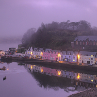 Buy canvas prints of  A misty evening view of Portree pier in the soft  by Richard Smith