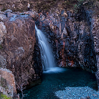 Buy canvas prints of A hillwalker above a waterfall at the Fairy Pools by Richard Smith