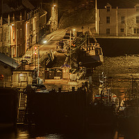 Buy canvas prints of Fishing vessels moored to Portree quay at night by Richard Smith