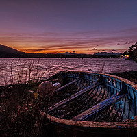 Buy canvas prints of Loch Portree sunrise viewed over a clinker rowboat by Richard Smith