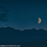 Buy canvas prints of A half moon over the Cuillin Hills. by Richard Smith