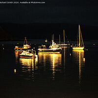 Buy canvas prints of A selection of sea vessels moored in Loch Portree overnight. by Richard Smith