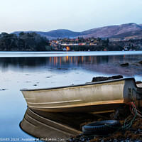 Buy canvas prints of A dinghy moored at the loch's edge with reflected view of Portree  by Richard Smith