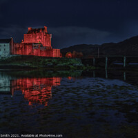 Buy canvas prints of Red and white floodlighting of Eilean Donan Castle for Remembrance Sunday by Richard Smith
