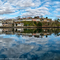 Buy canvas prints of The town of Portree surrounds the harbour with reflections of the sky. #2 by Richard Smith