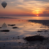 Buy canvas prints of Floating at Sunset by Nigel Jones