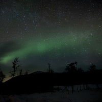 Buy canvas prints of   Northern Lights and Starlight by Nigel Jones