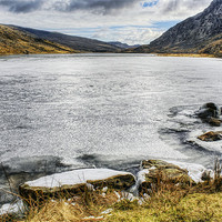 Buy canvas prints of Frozen Lake Ogwen by Ian Mitchell
