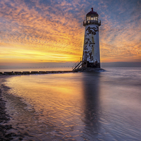 Buy canvas prints of Sunset at the Lighthouse by Ian Mitchell