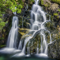 Buy canvas prints of Aqua Waterfall  by Ian Mitchell