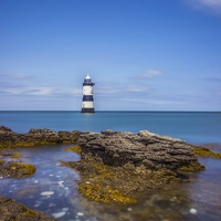 Buy canvas prints of Penmon Lighthouse  by Ian Mitchell