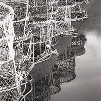 Buy canvas prints of Lobster Pots Reflection by John Piper