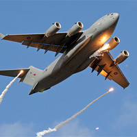 Buy canvas prints of C-17 firing flares by Rachel & Martin Pics