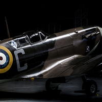Buy canvas prints of Spitfire in the shadows by Keith Campbell
