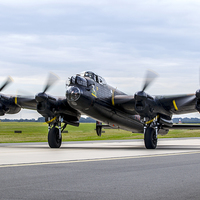 Buy canvas prints of  RAF Lancaster PA474 taxies in by Keith Campbell