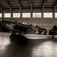 Buy canvas prints of  RAF Spitfire in the hanger by Keith Campbell