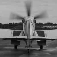 Buy canvas prints of  Spitfire PS915 - mono by Keith Campbell
